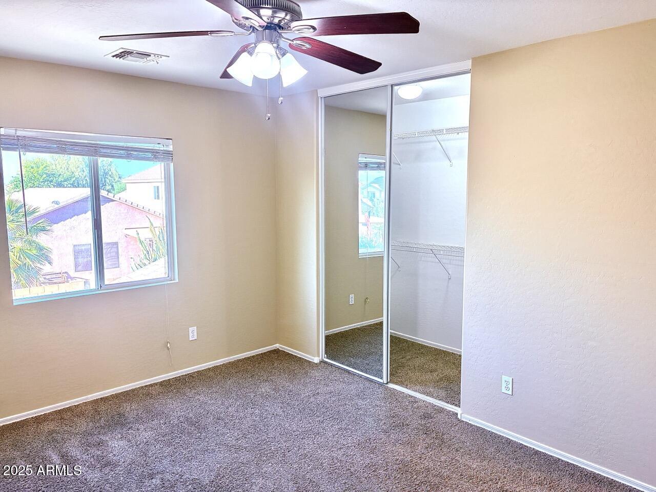 4014 East Superior Road San Tan Valley, AZ 85143 - Photo 27 of 36 an empty room with windows and fan
