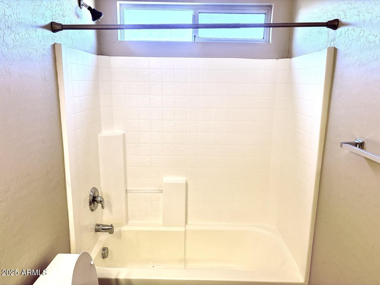 4014 East Superior Road San Tan Valley, AZ 85143 - Photo 31 of 36 a bathroom with a bathtub and a shower