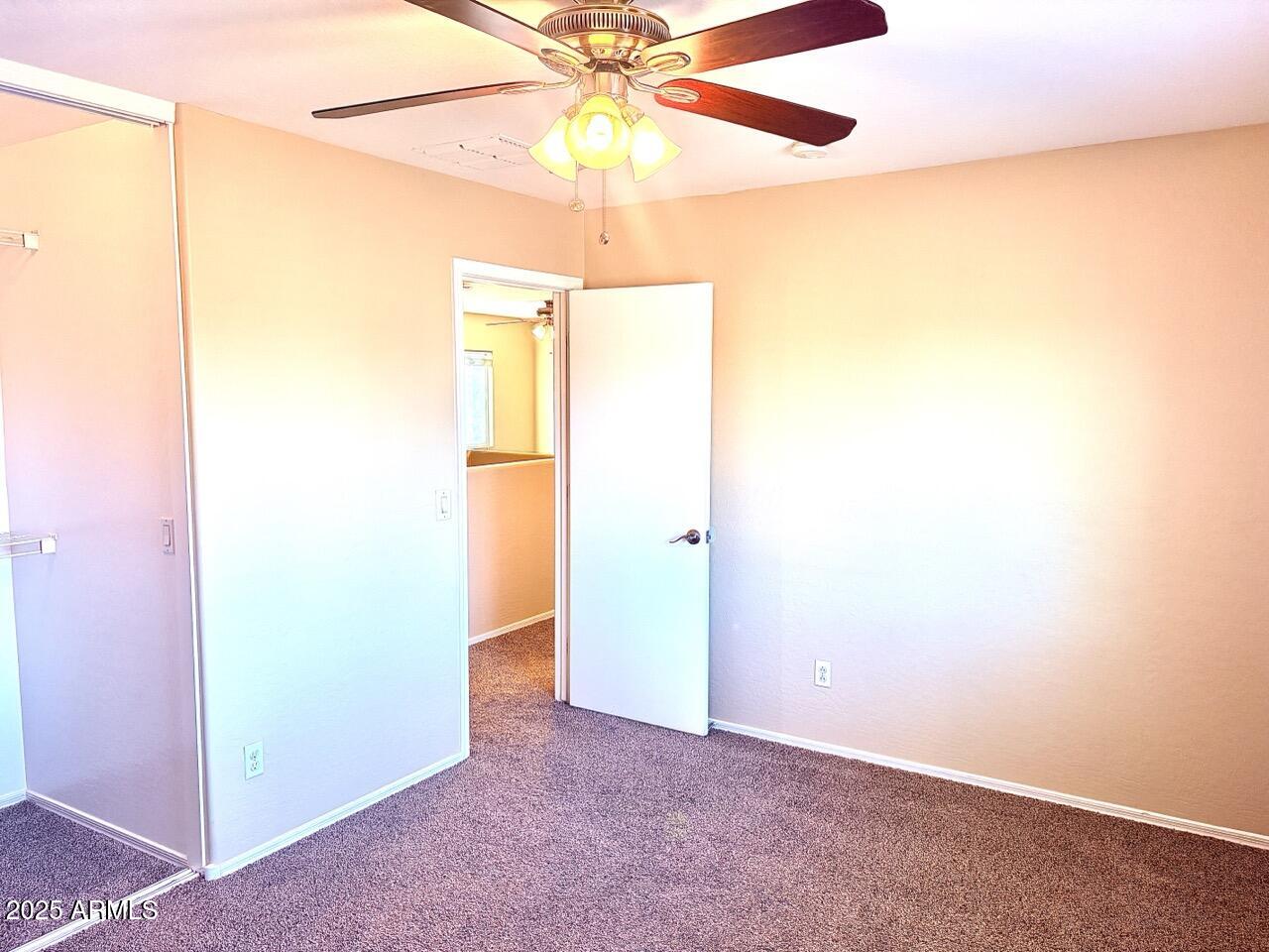 4014 East Superior Road San Tan Valley, AZ 85143 - Photo 32 of 36 an empty room with a fan and a fan