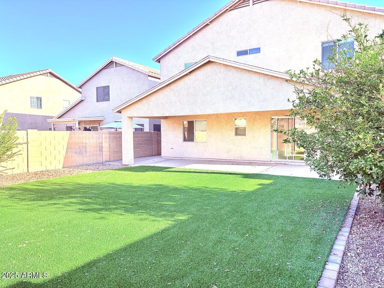 4014 East Superior Road San Tan Valley, AZ 85143 - Photo 5 of 36 a front view of a house with a yard and garage
