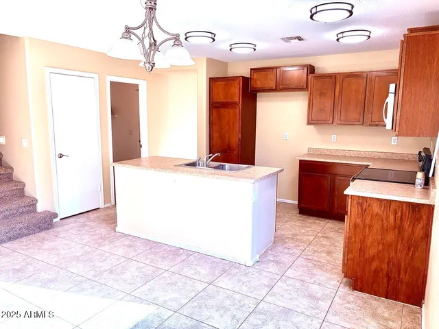a view of a kitchen with a sink