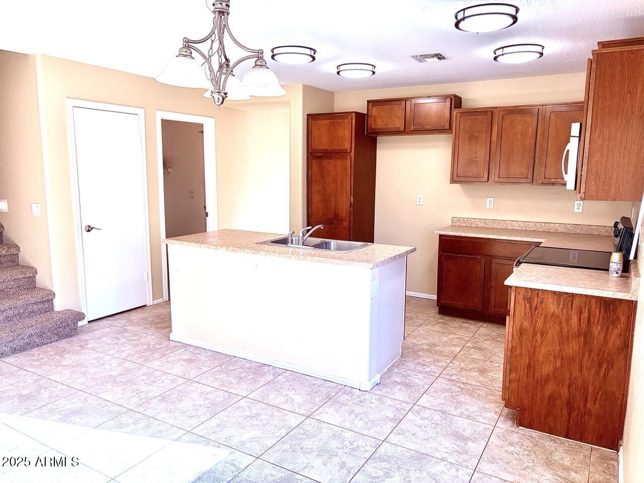 4014 East Superior Road San Tan Valley, AZ 85143 - Photo 7 of 36 a view of a kitchen with a sink