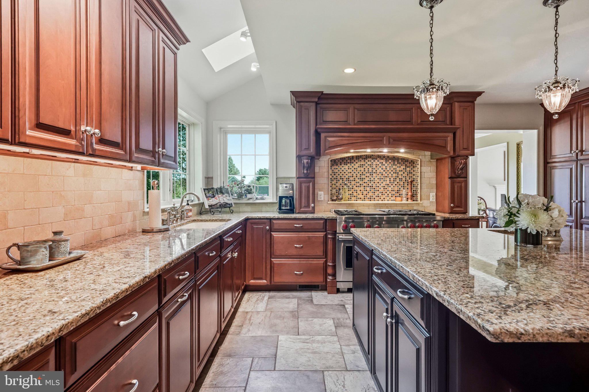 630 Leopard Road Berwyn, PA 19312 - Photo 17 of 91 Elegant kitchen with rich wood tones.
