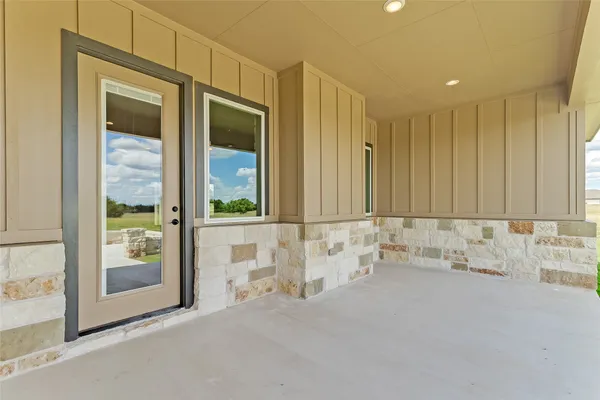 a view of a house with a swimming pool and a outdoor space