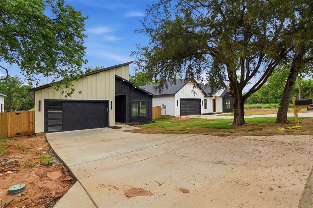 1111 Riverwood Road Dallas, TX 75217 - Photo 7 of 40 Modern architectural style with a black and white vertical board-and-batten exterior