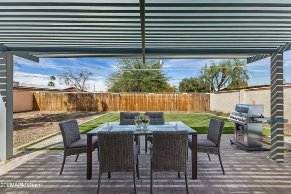 a view of outdoor dining space with furniture