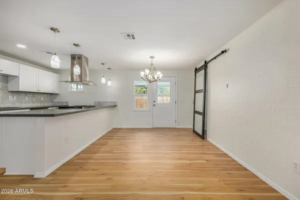 a view of a kitchen with granite countertop cabinets a sink and dishwasher