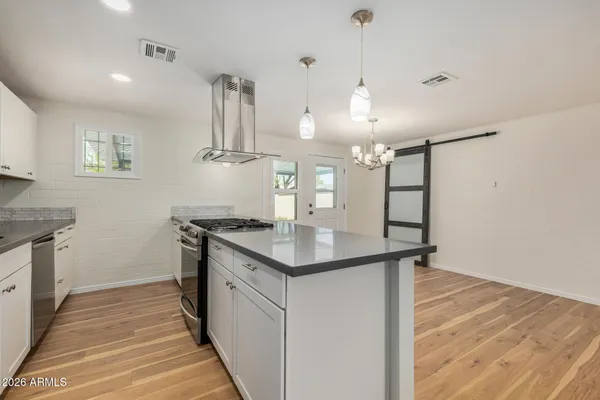 a kitchen with a sink and stove