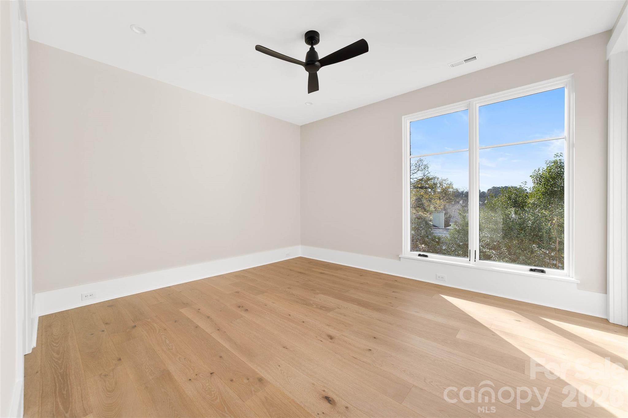 216 Walnut Street Davidson, NC 28036 - Photo 35 of 48 an empty room with a window