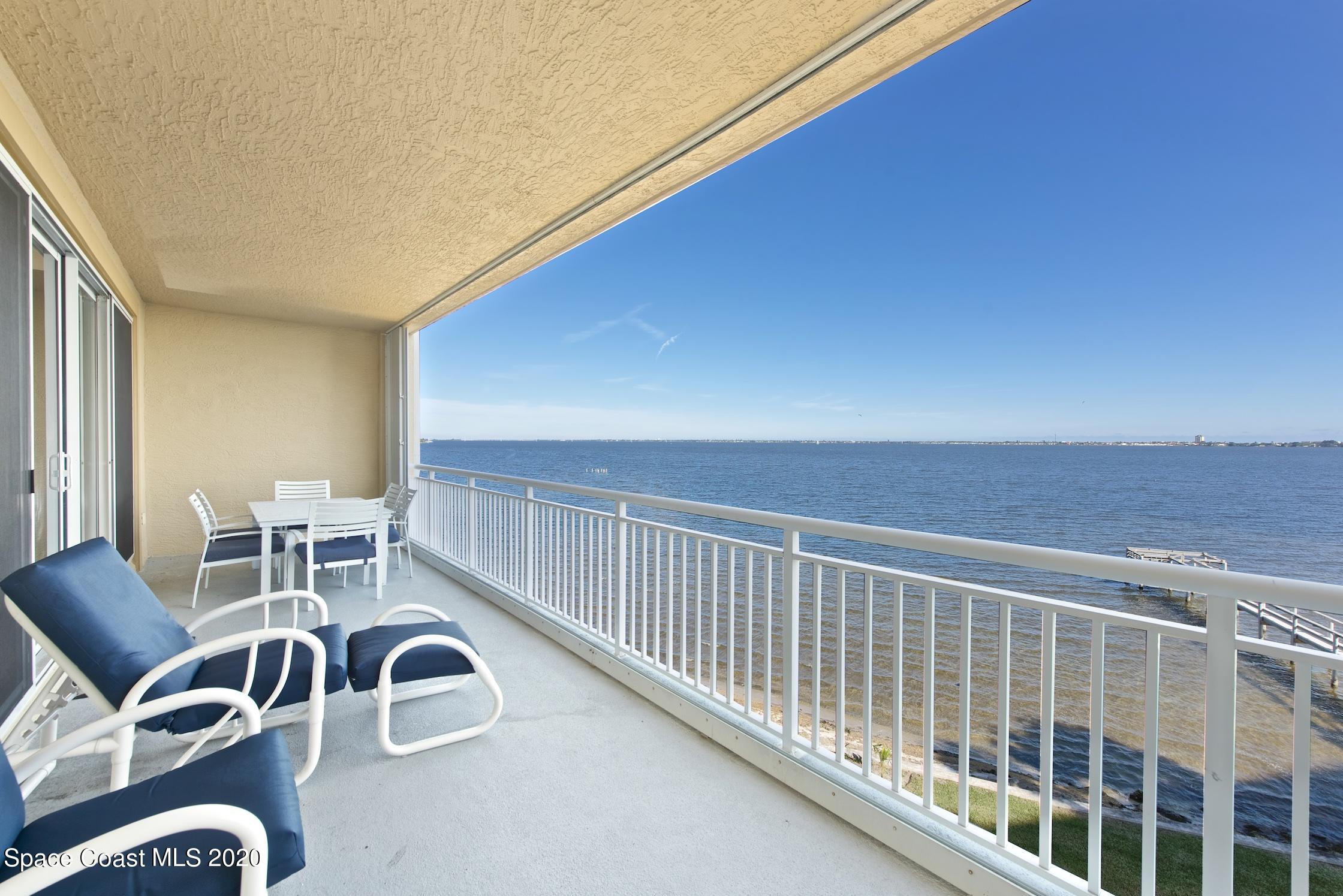 4955 Dixie Highway Northeast, Unit 404 Palm Bay, FL 32905 - Photo 11 of 50 a view of a chairs and table in patio