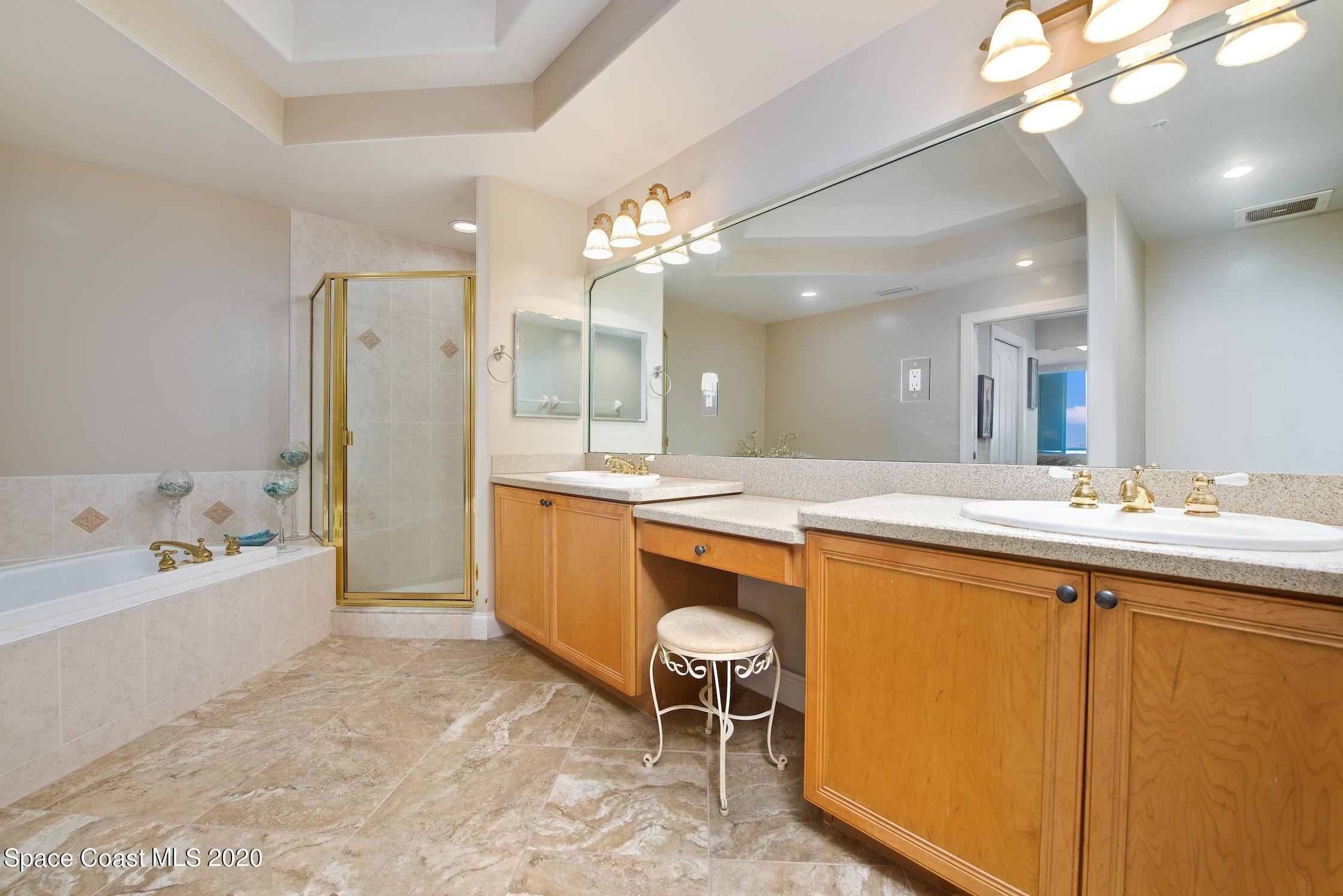 4955 Dixie Highway Northeast, Unit 404 Palm Bay, FL 32905 - Photo 18 of 50 a large bathroom with a large tub and sink