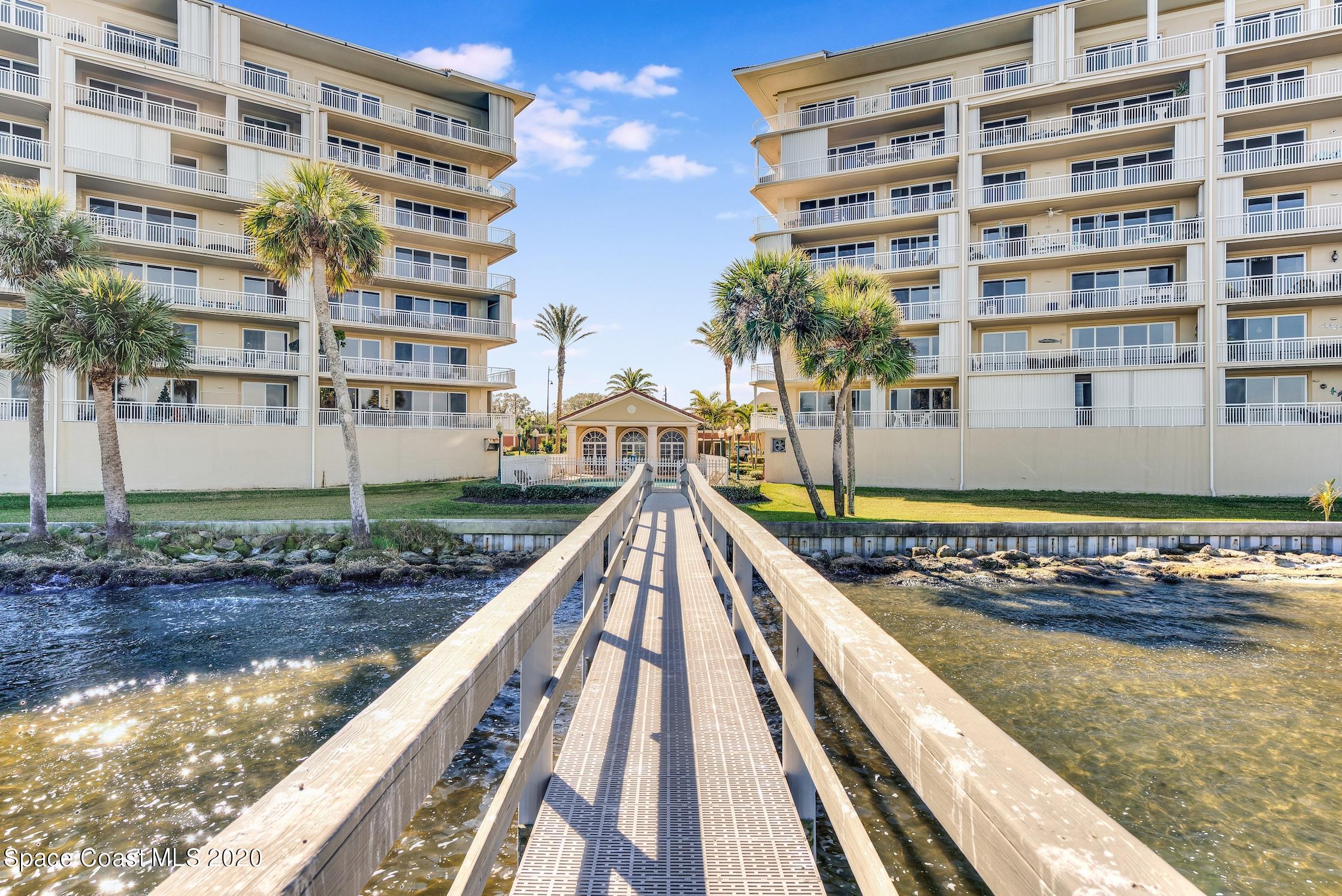 4955 Dixie Highway Northeast, Unit 404 Palm Bay, FL 32905 - Photo 28 of 50 a view of building with swimming pool and outdoor space