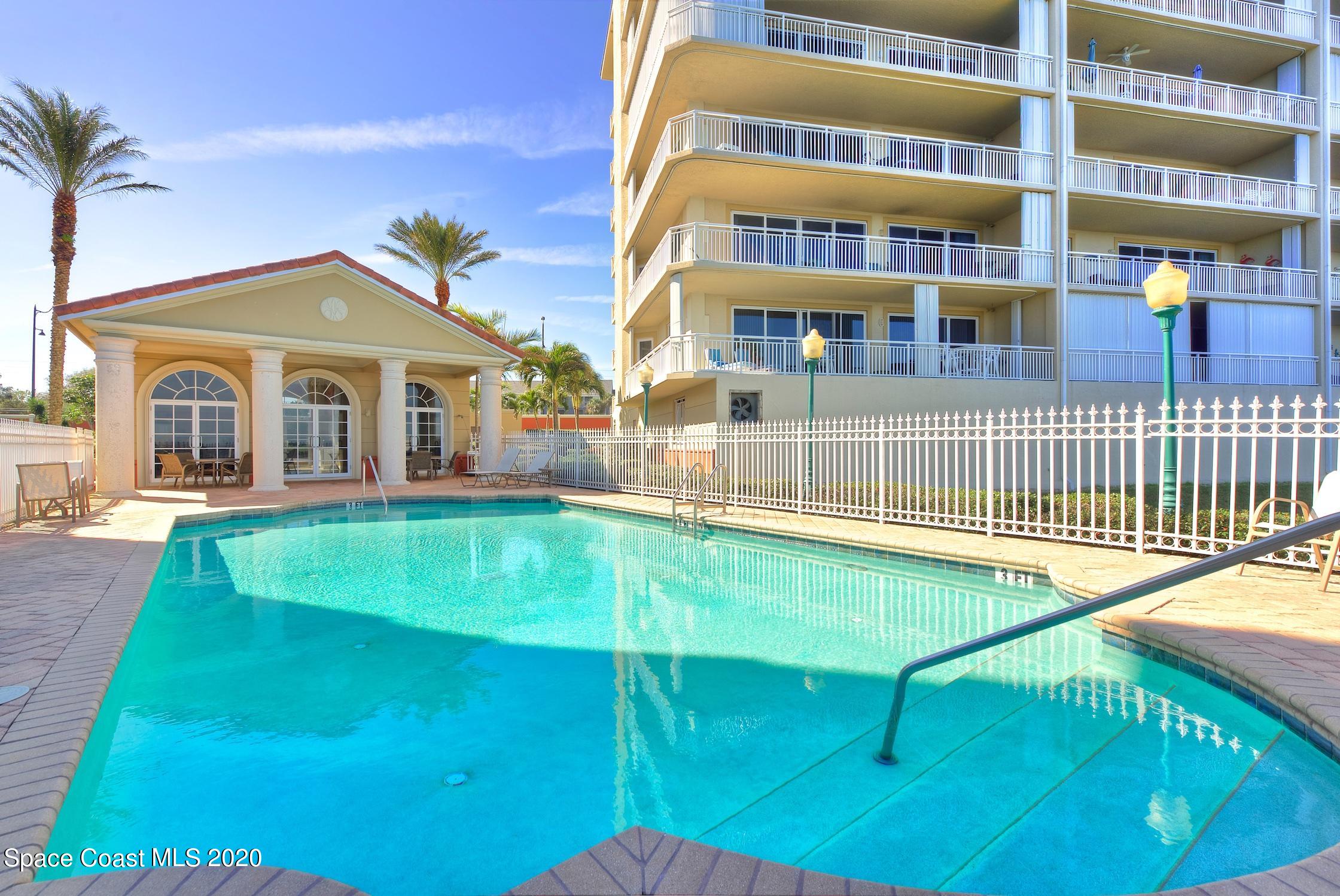 4955 Dixie Highway Northeast, Unit 404 Palm Bay, FL 32905 - Photo 31 of 50 a view of a building with a backyard
