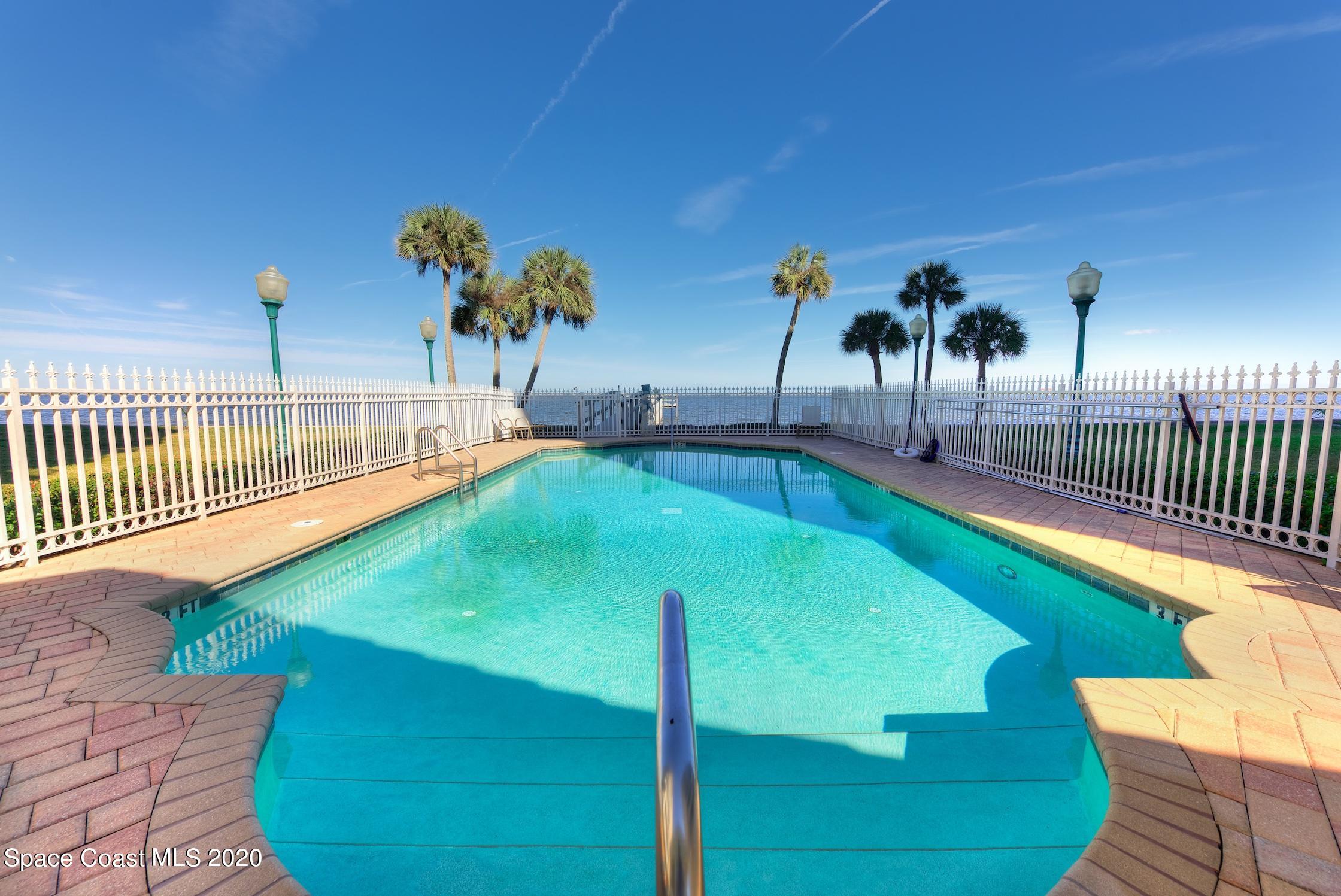 4955 Dixie Highway Northeast, Unit 404 Palm Bay, FL 32905 - Photo 32 of 50 a view of a swimming pool with a bench