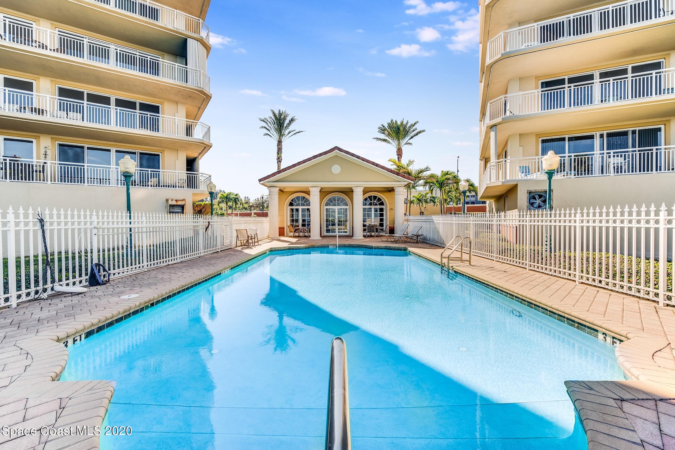 4955 Dixie Highway Northeast, Unit 404 Palm Bay, FL 32905 - Photo 33 of 50 a view of a building with a swimming pool