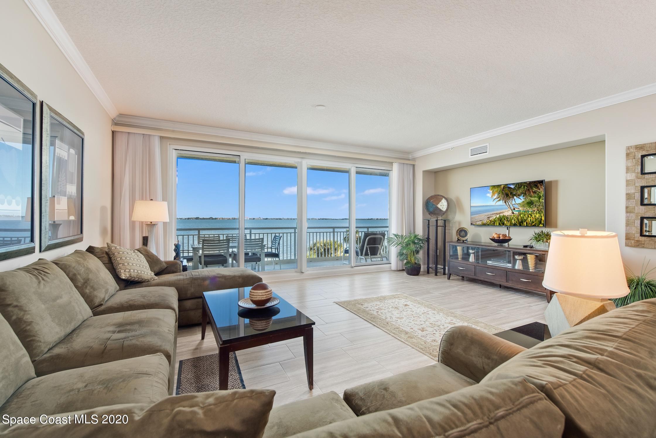 4955 Dixie Highway Northeast, Unit 404 Palm Bay, FL 32905 - Photo 5 of 50 a living room with furniture and a large window