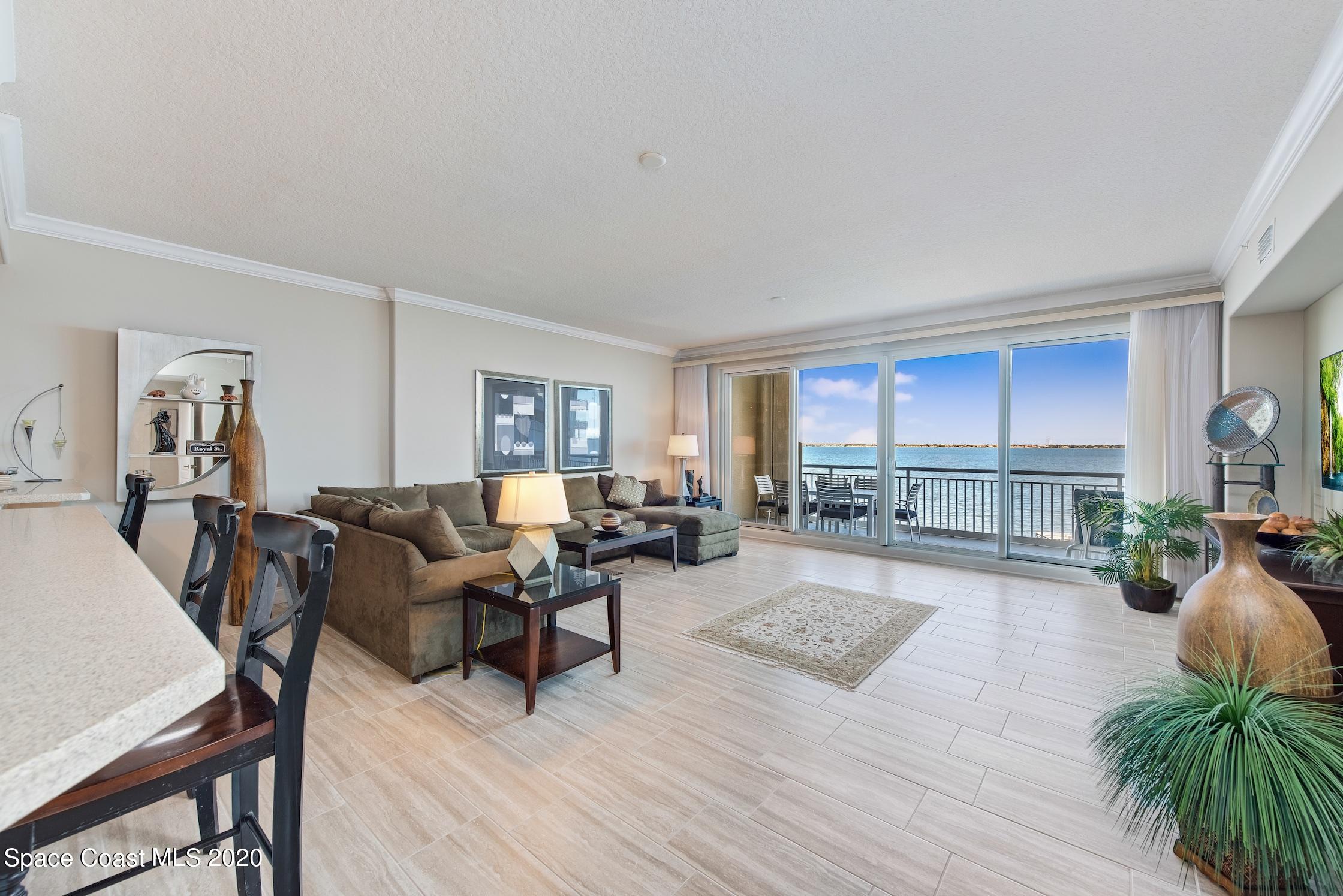 4955 Dixie Highway Northeast, Unit 404 Palm Bay, FL 32905 - Photo 8 of 50 a living room with furniture and a wooden floor