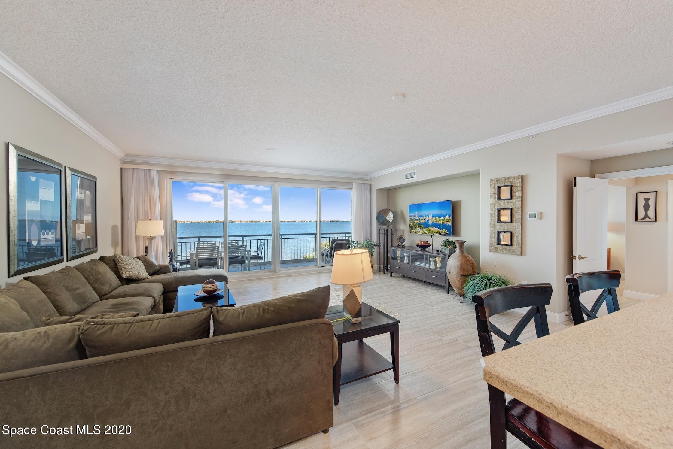 4955 Dixie Highway Northeast, Unit 404 Palm Bay, FL 32905 - Photo 9 of 50 a living room with furniture and a large window