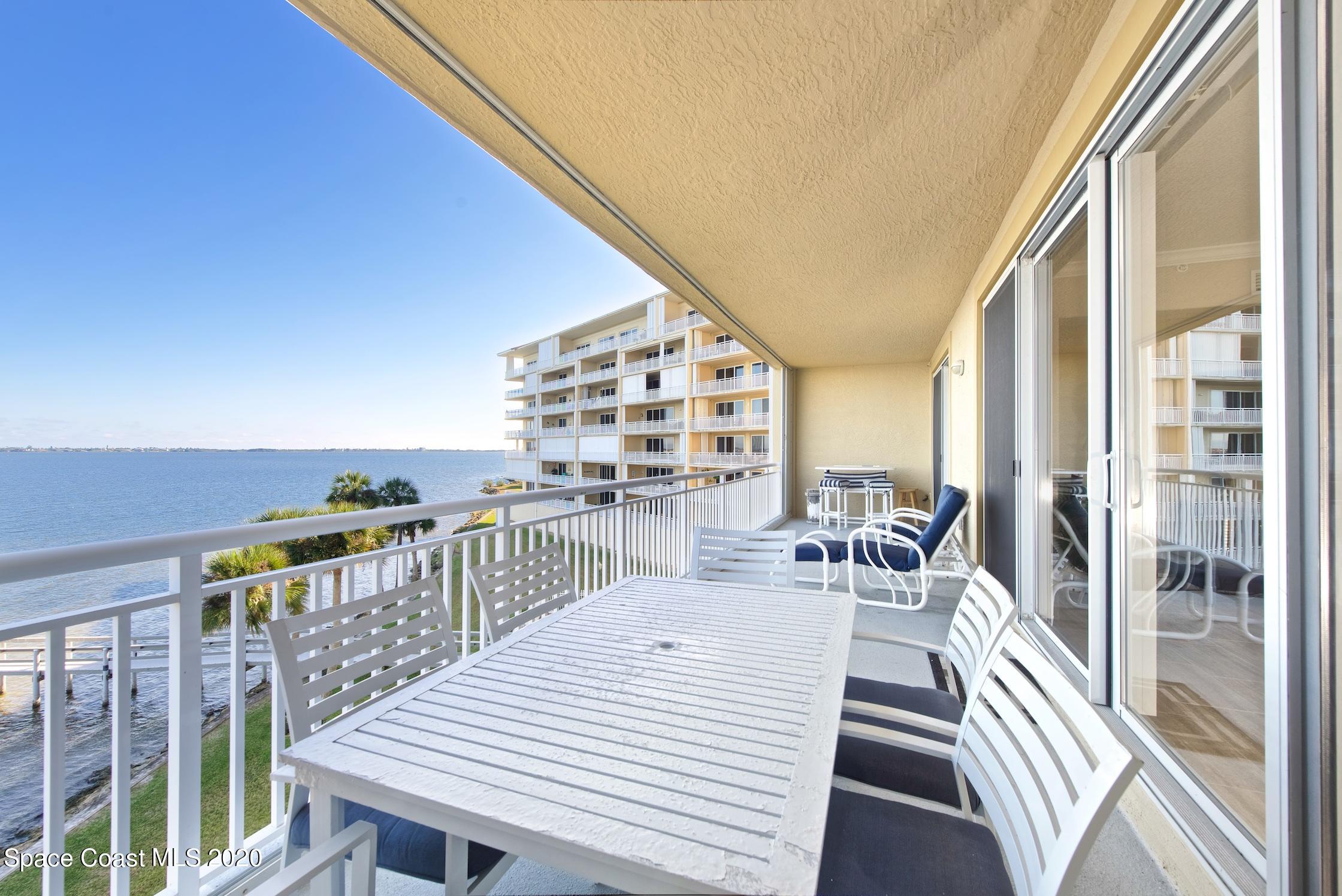 4955 Dixie Highway Northeast, Unit 404 Palm Bay, FL 32905 - Photo 10 of 50 a balcony with wooden floor