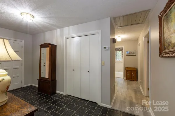 a bathroom with a glass door shower and a sink