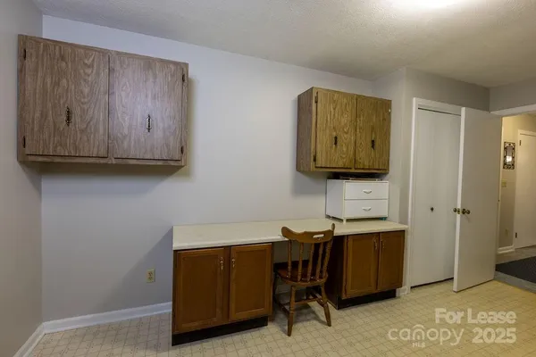 a workspace with furniture and mirror