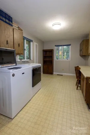 a kitchen with stainless steel appliances a stove sink and cabinets