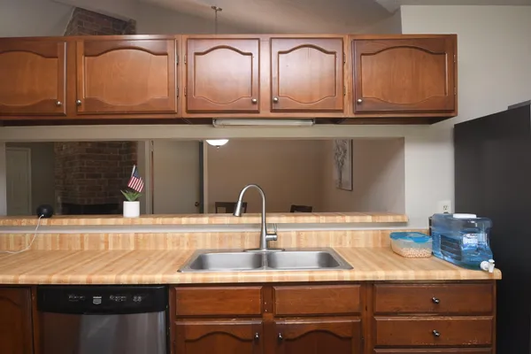 a kitchen with a sink and cabinets