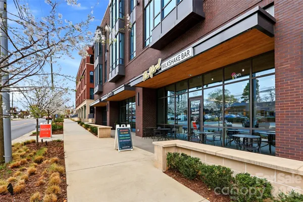 a view of path along with retail shop and retail shops