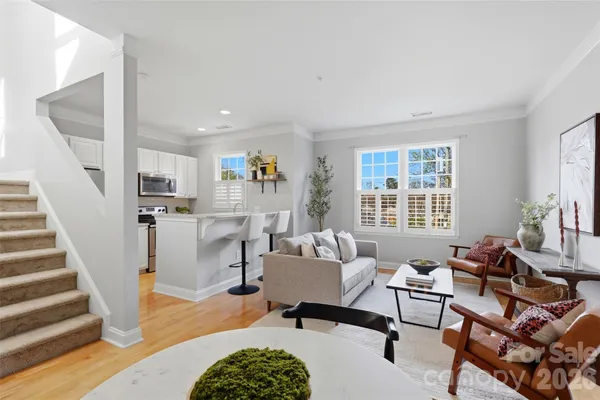 a living room with furniture and a table