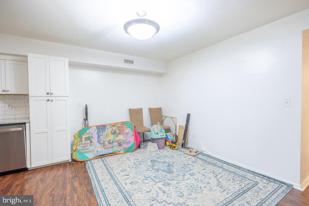 7549 Spring Lake Drive, Unit D2 Bethesda, MD 20817 - Photo 14 of 14 a workspace with furniture and wooden floor