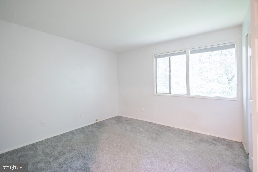 7549 Spring Lake Drive, Unit D2 Bethesda, MD 20817 - Photo 4 of 14 an empty room with a window