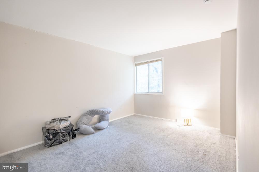 7549 Spring Lake Drive, Unit D2 Bethesda, MD 20817 - Photo 8 of 14 a room with a toys