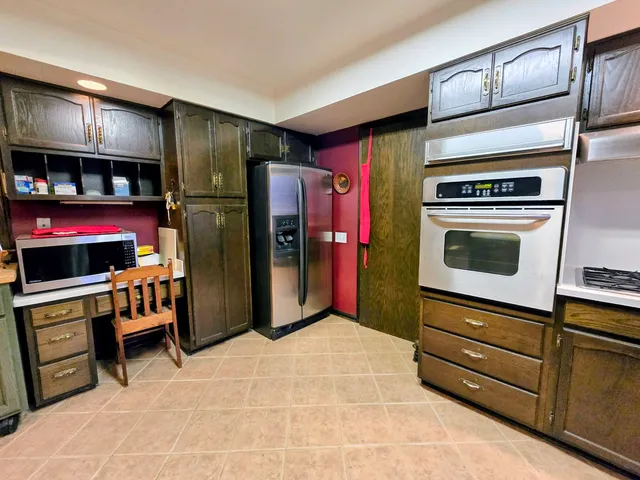 a kitchen with a sink cabinets and window