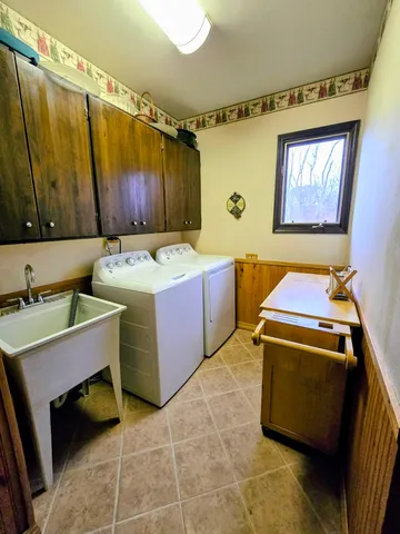 a bedroom with a bed a desk and chair