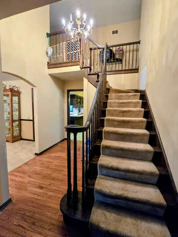 a room with pool table and windows