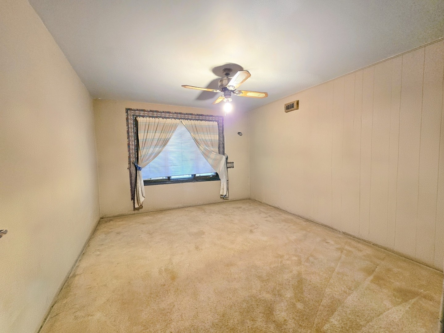 24656 South Willow Brook Trail Crete, IL 60417 - Photo 29 of 39 an empty room with chandelier fan and wooden floor