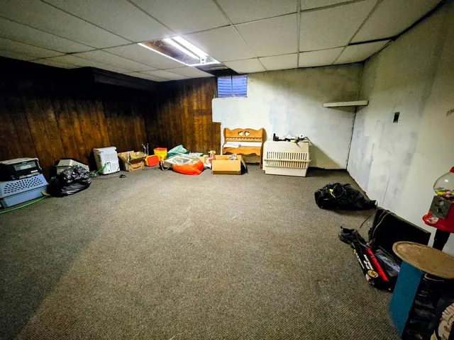 a aerial view of a house with swimming pool and a yard