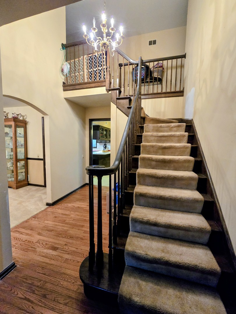 24656 South Willow Brook Trail Crete, IL 60417 - Photo 33 of 39 a view of entryway and hall with wooden floor