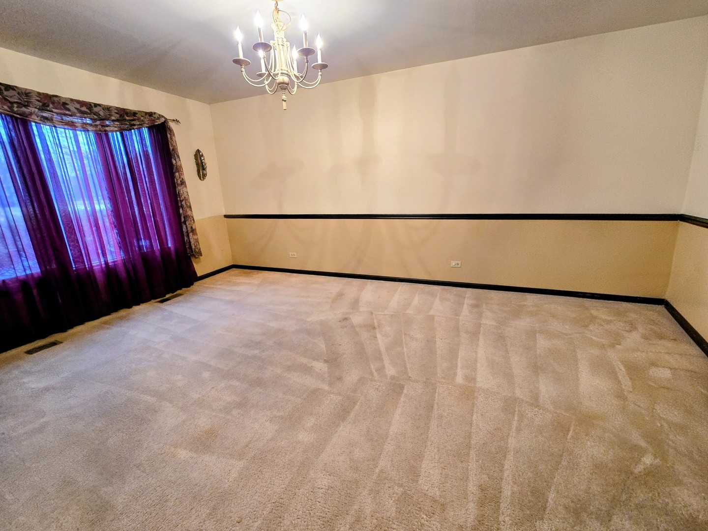 24656 South Willow Brook Trail Crete, IL 60417 - Photo 10 of 39 a view of a big room with windows and chandelier