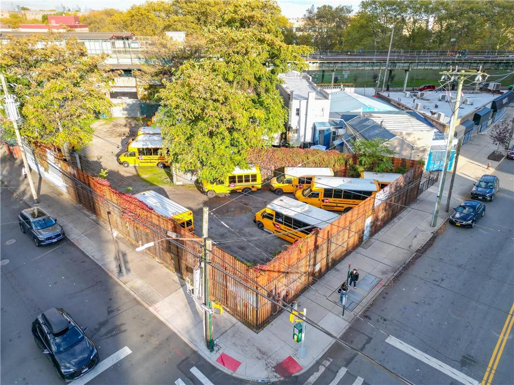 2432 Stillwell Avenue Brooklyn, NY 11214 - Photo 2 of 2 an aerial view of a house with a garden