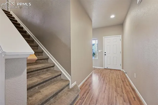 wooden floor with staircase