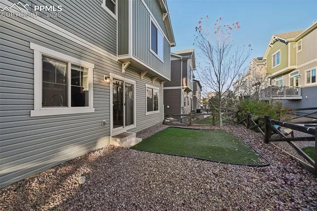 a view of a park with plants and a bench