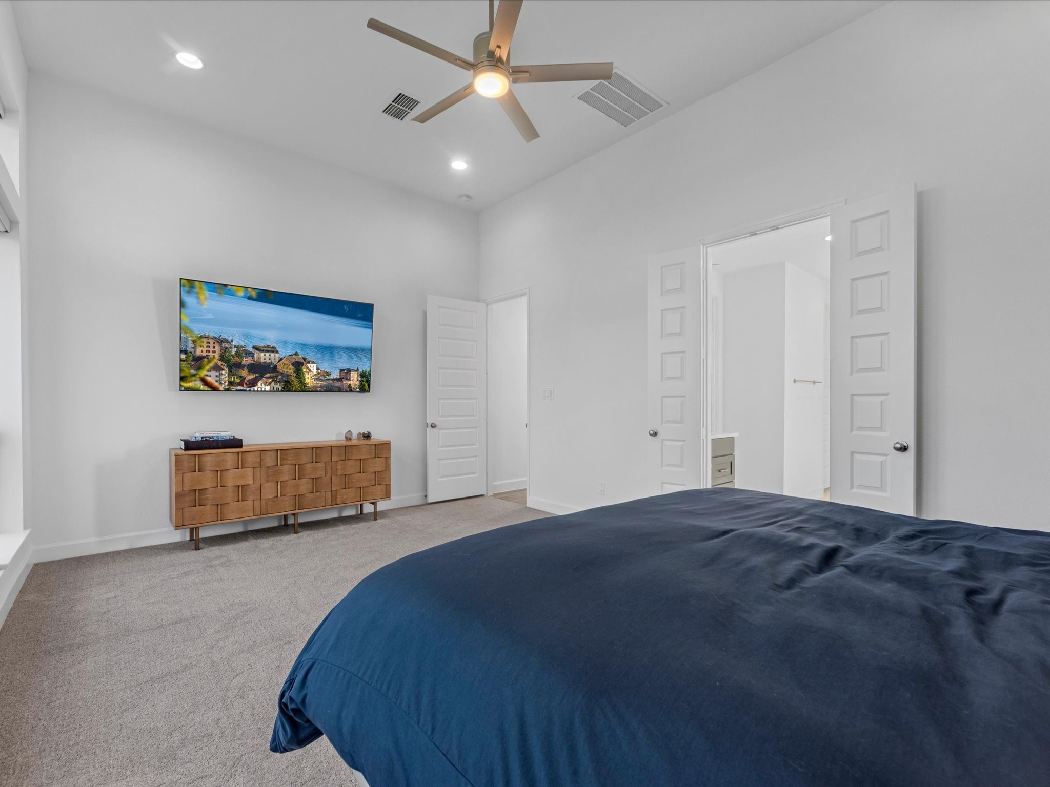 18714 Pistachio Way Manvel, TX 77578 - Photo 19 of 48 Retreat to the spacious primary suite, where privacy, abundant natural light, and elegant double doors leading to the spa-inspired primary bath create a peaceful sanctuary to begin and end each day.