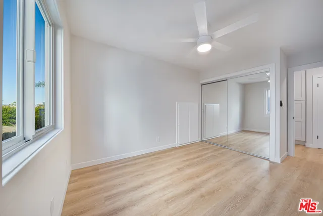 a kitchen with stainless steel appliances a sink dishwasher stove microwave and cabinets