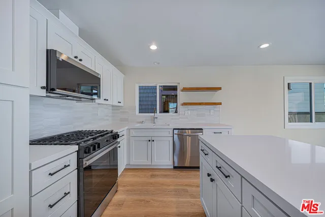 a view of kitchen with wooden floor