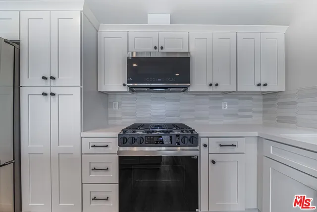 a view of kitchen with wooden floor