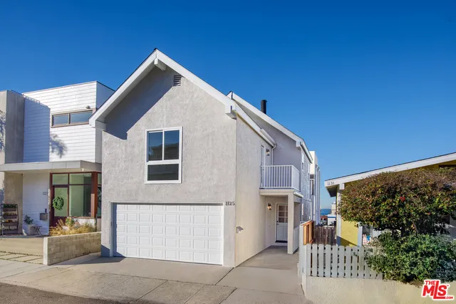 an aerial view of a city with ocean view