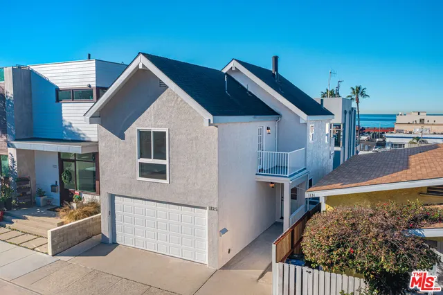 an aerial view of a house with a swimming pool
