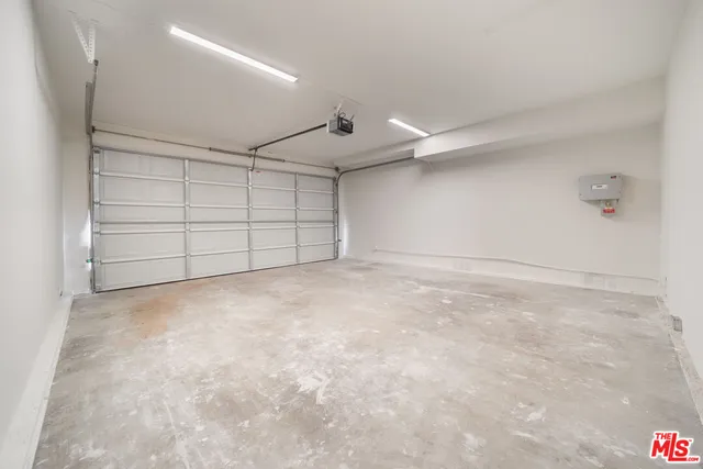 an empty room with wooden floor and closet