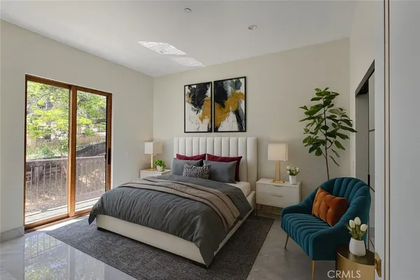 a bedroom with a bed and a potted plant